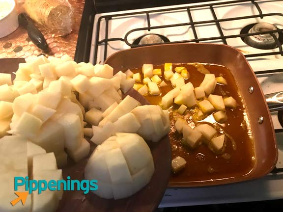 Indian potatoes going into the pot