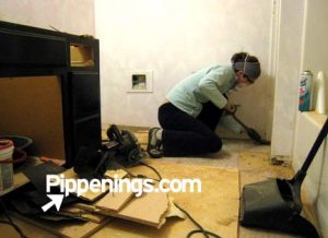 Pippi tearing out rotten subfloor